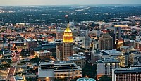 Atlanta's skyline illuminated at night, showcasing vibrant city lights and a bustling urban atmosphere.